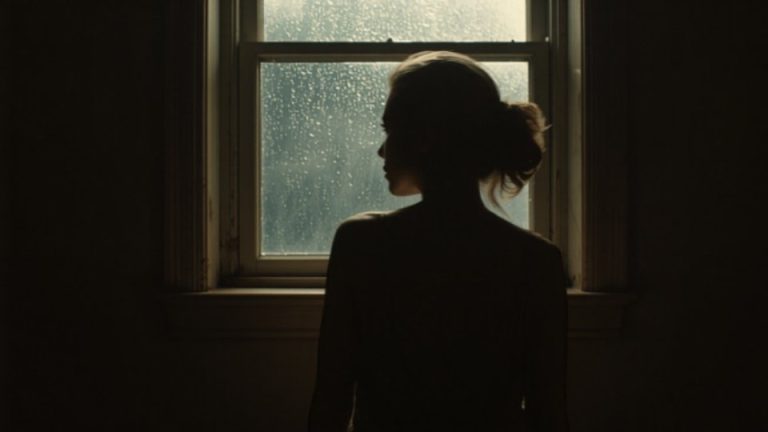 What Is Trauma Dumping hero image of a woman staring out a window symbolizing the trauma dump.