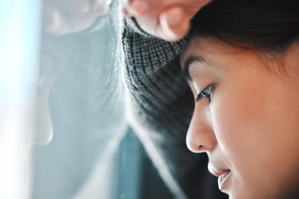 Woman experiencing emotional distress associated with PTSD symptoms in women